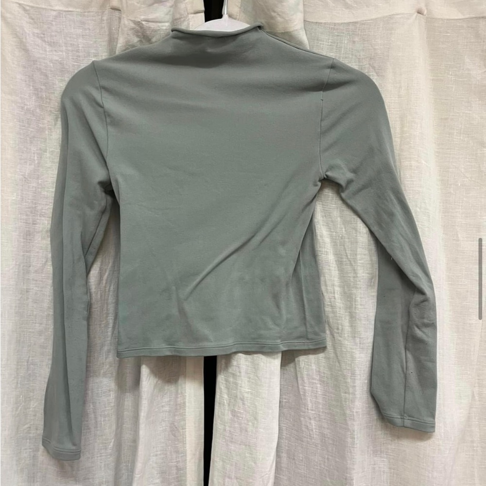 Fabletics athletics shirt. Tighter fitting athletic material. Sage green